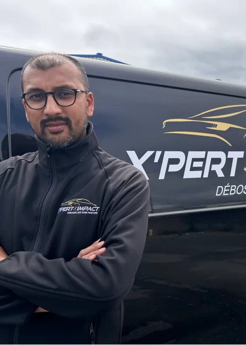 a man standing in front of a black van