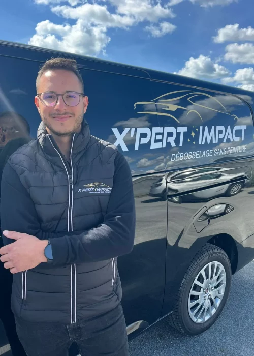 a man standing in front of a black van