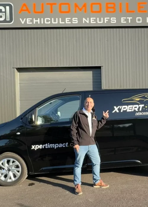 a man standing in front of a black van