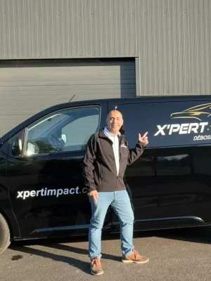 XP58A – Nevers – Aurélien RAIMOND a man standing in front of a black van