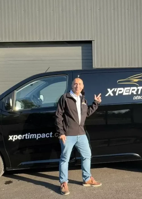 a man standing in front of a black van