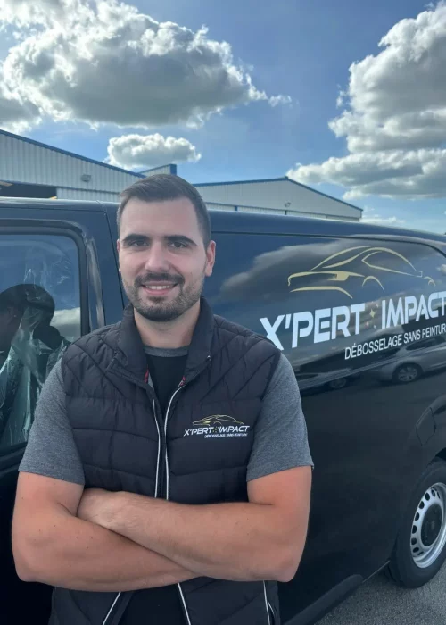 a man standing in front of a black van